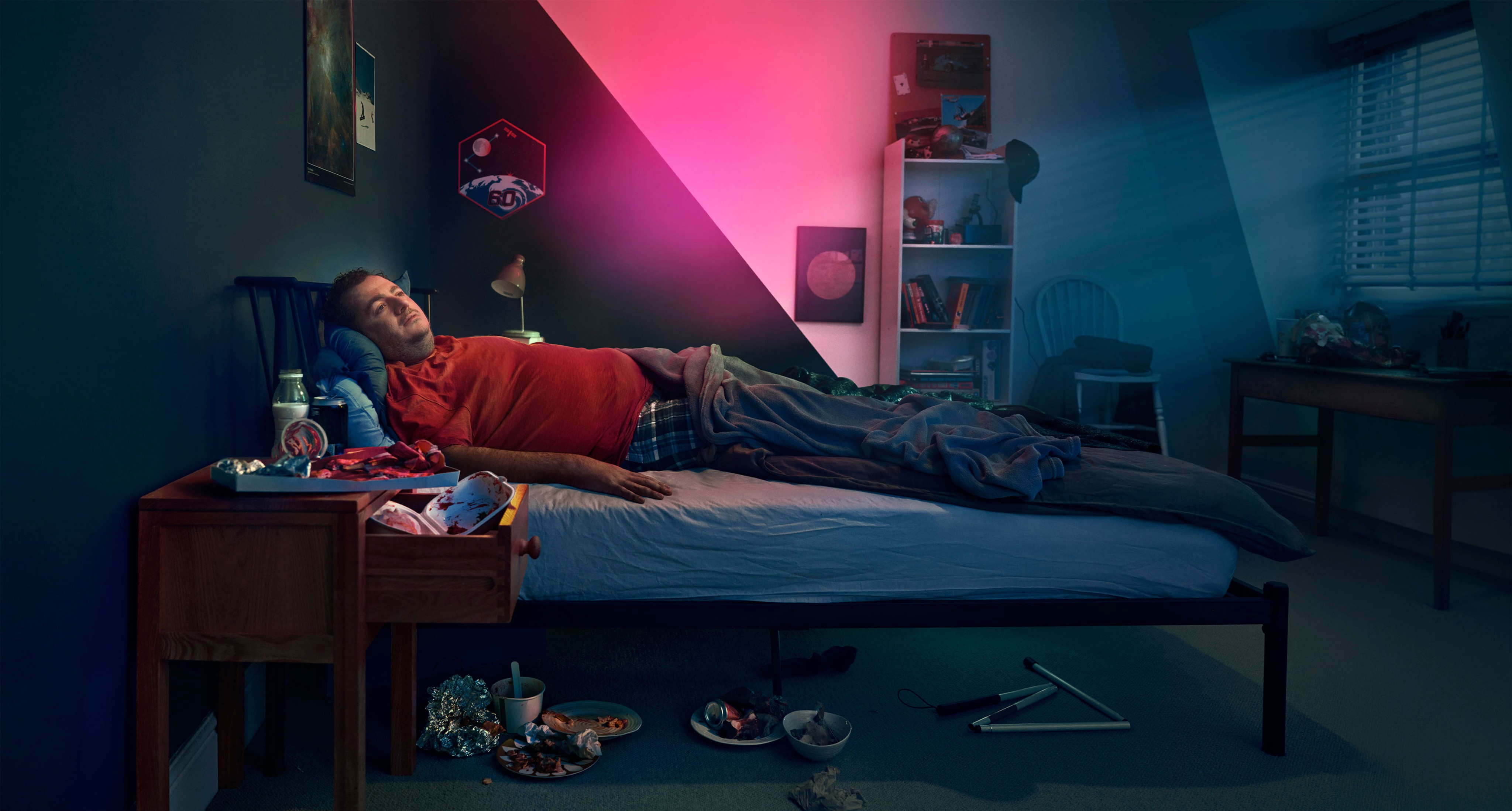 Man laying in a bed. Actor portrayal.